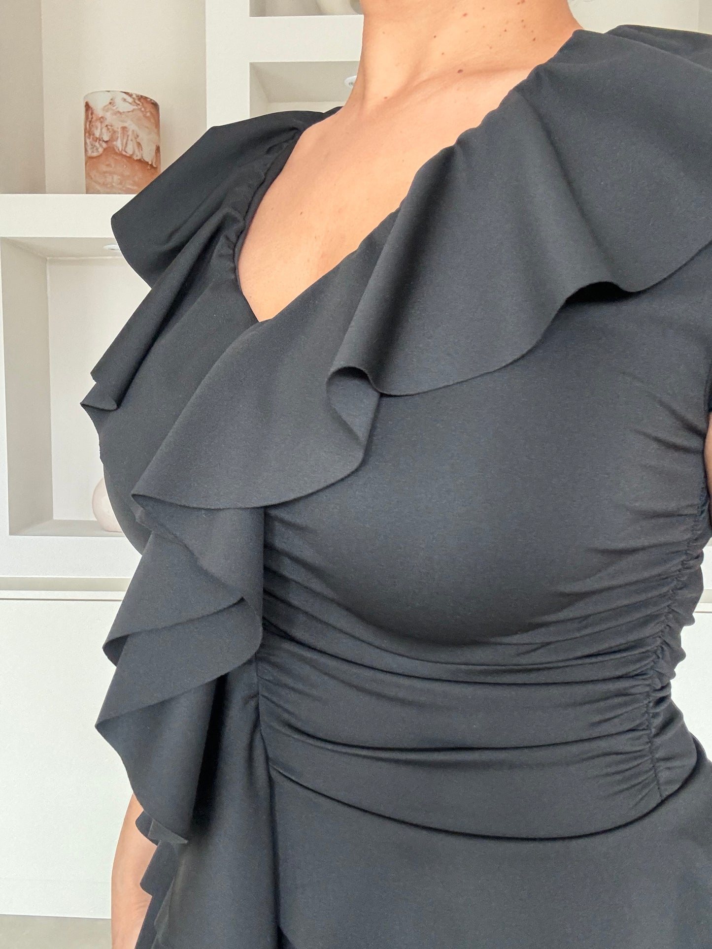 Ruffle black top